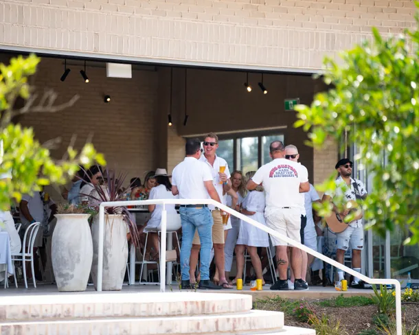 Guests on The Pavilion terrace at The Orchard
